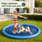 Happy child in a colorful swimsuit and a dog enjoying summer water play in the backyard sprinkler pool.